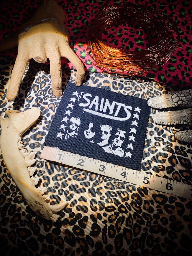 The Saints sew on patch.