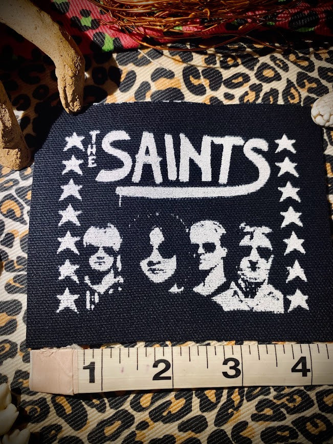 The Saints sew on patch.