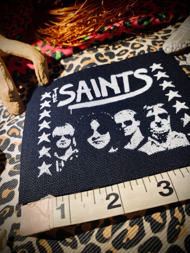 The Saints sew on patch.