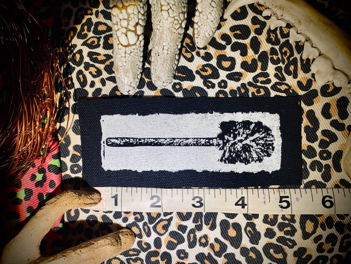 Toilet brush sew on patch.