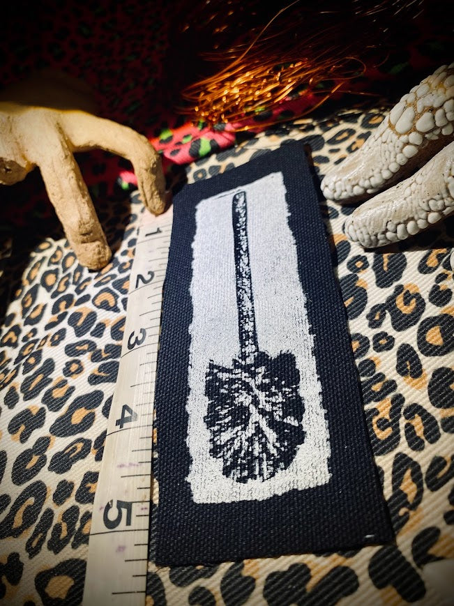 Toilet brush sew on patch.