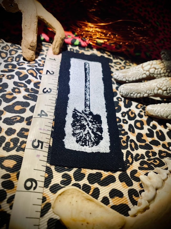 Toilet brush sew on patch.