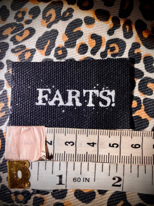 It's a tiny patch that says Farts.