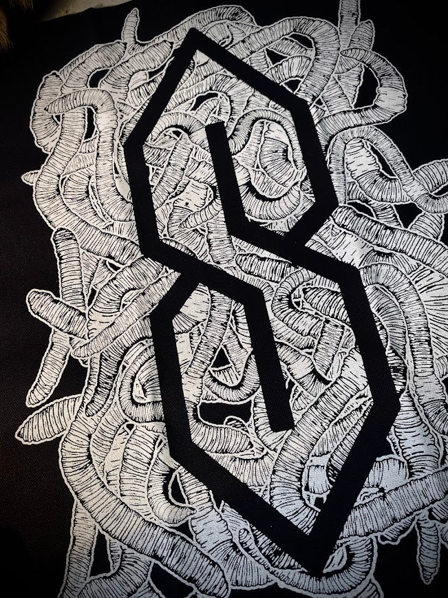 The cool S covered in worms back patch.