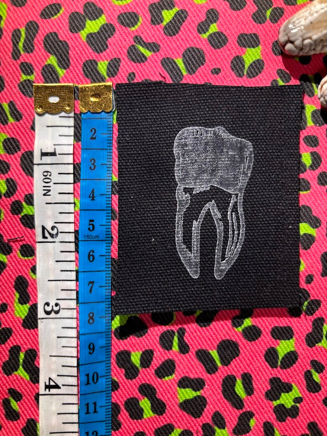 loose tooth patch. a mini patch with one toof