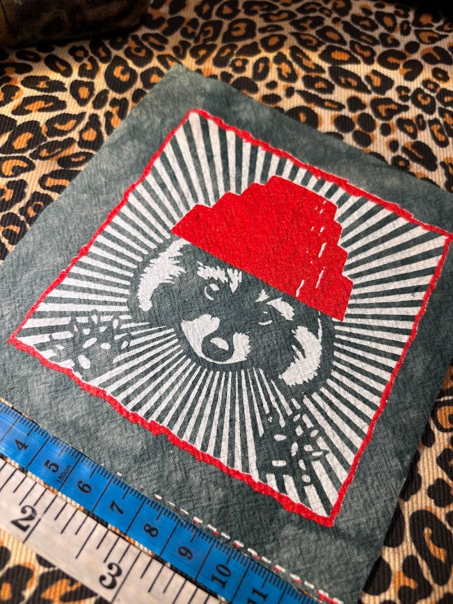 Are We not Trashy? Raccoon with a Devo hat patch