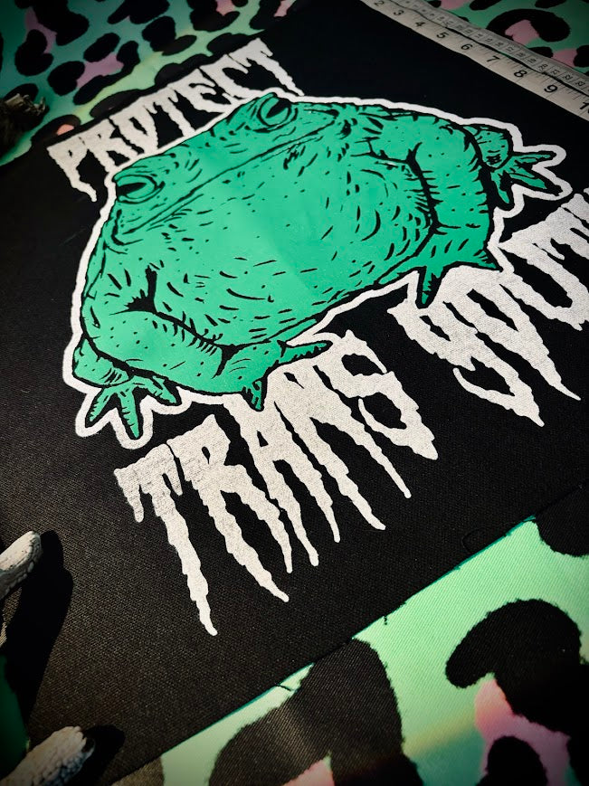 Protect trans youth with a chonky toad backpatch