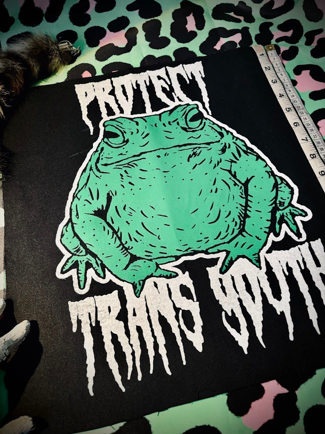 Protect trans youth with a chonky toad backpatch