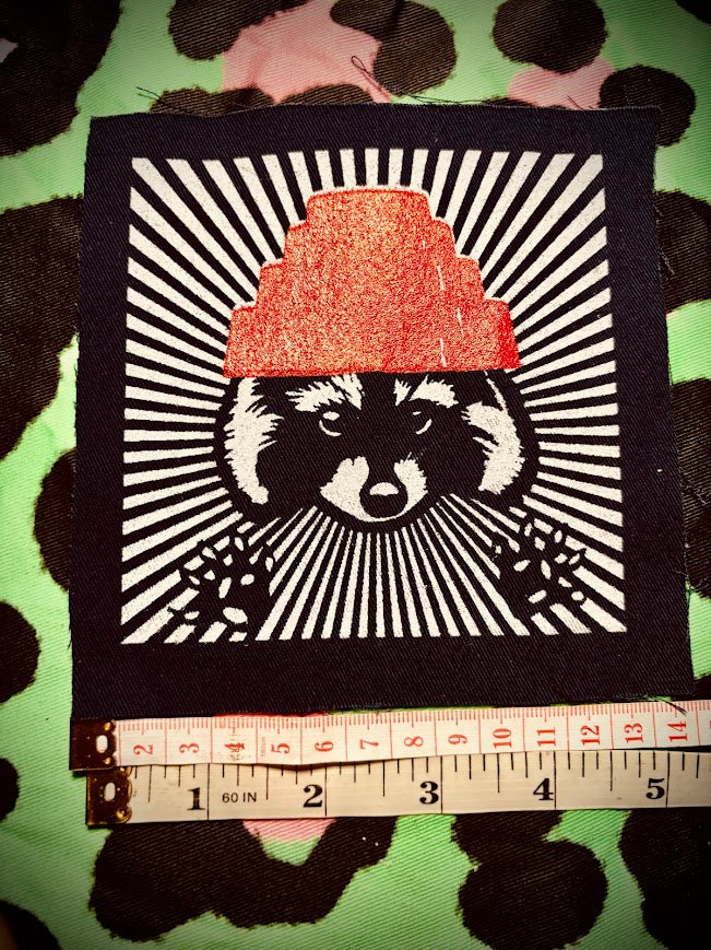 Are We not Trashy? Raccoon with a Devo hat patch