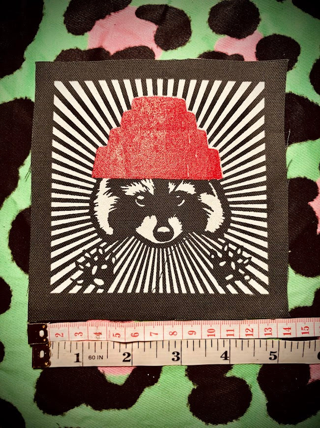 Are We not Trashy? Raccoon with a Devo hat patch