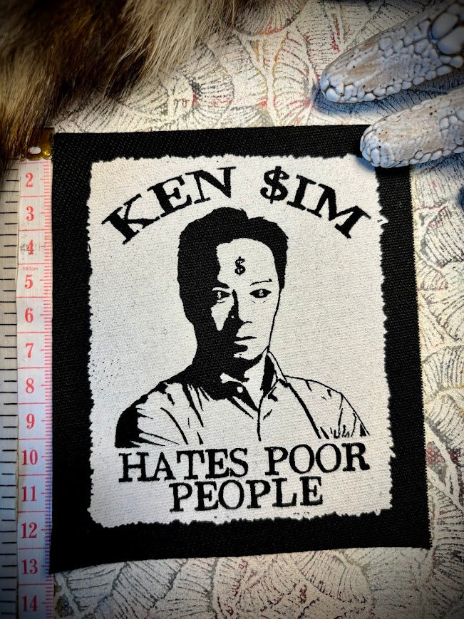 Ken Sim hates poor people sew on patch