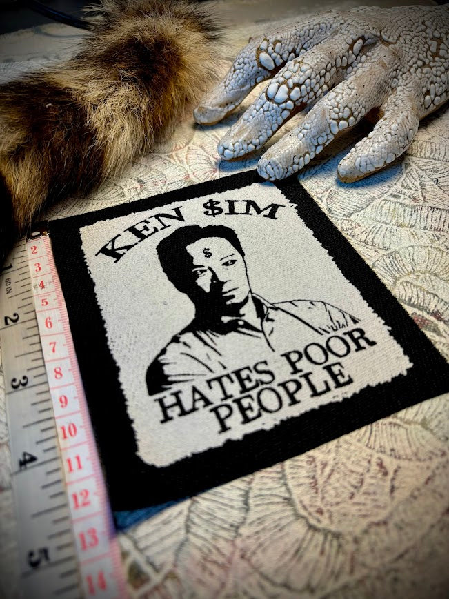 Ken Sim hates poor people sew on patch