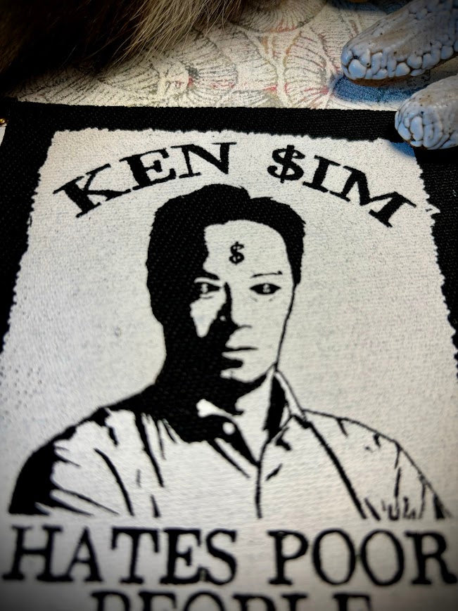 Ken Sim hates poor people sew on patch