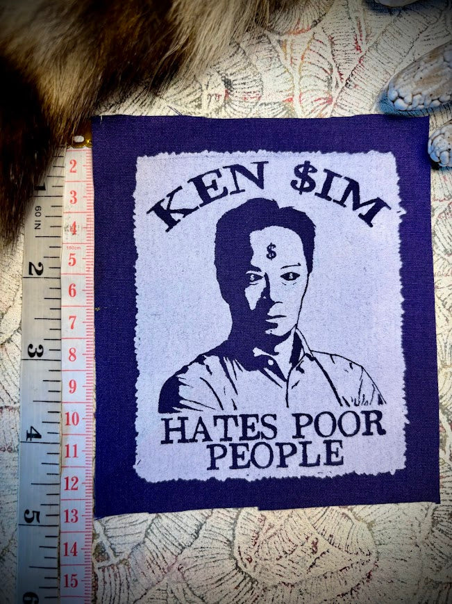 Ken Sim hates poor people sew on patch