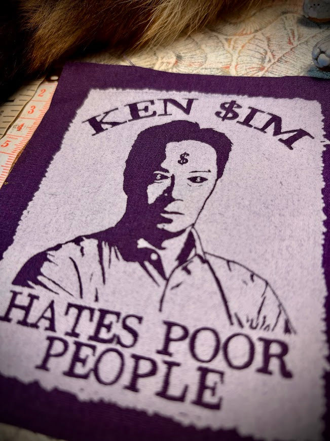 Ken Sim hates poor people sew on patch