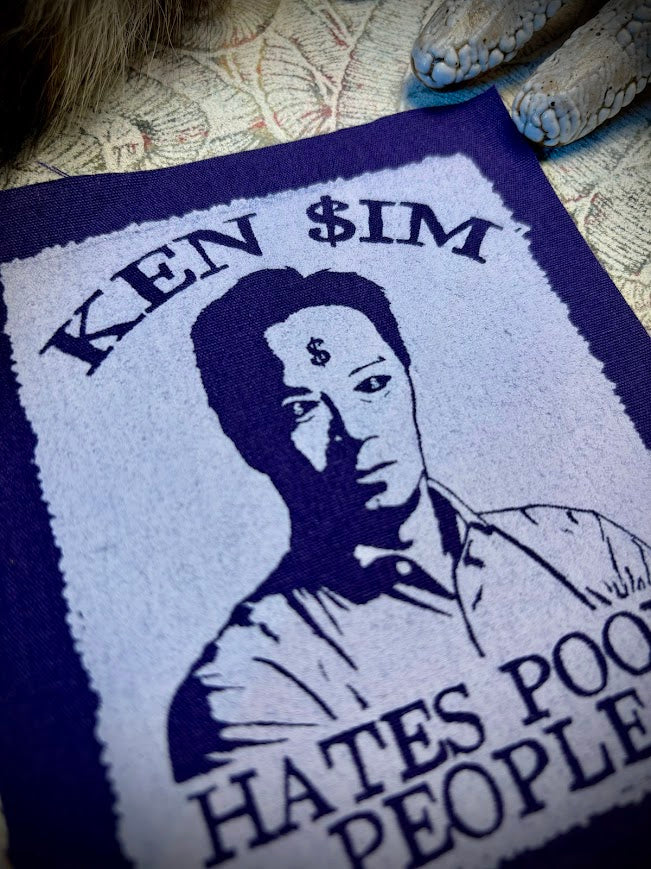 Ken Sim hates poor people sew on patch