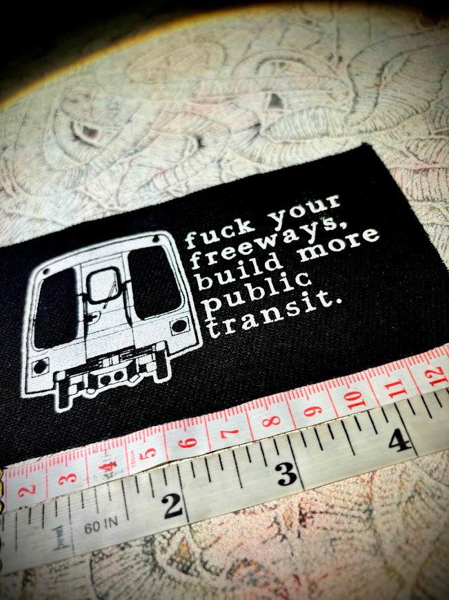 Fuck your freeways, build more public transit sew on patch.