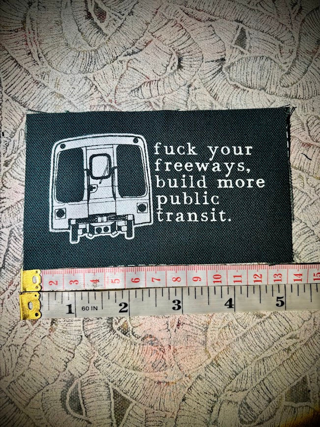 Fuck your freeways, build more public transit sew on patch.