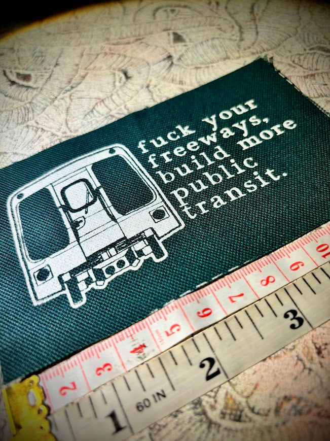 Fuck your freeways, build more public transit sew on patch.