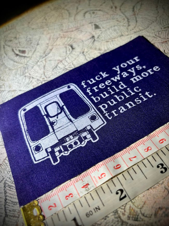 Fuck your freeways, build more public transit sew on patch.