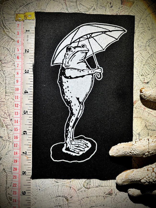 Sad frog holding an umbrella in the rain sew on patch.