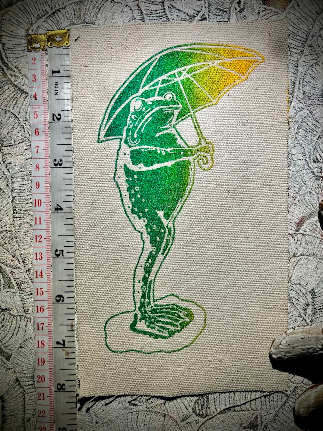 Sad frog holding an umbrella in the rain sew on patch.