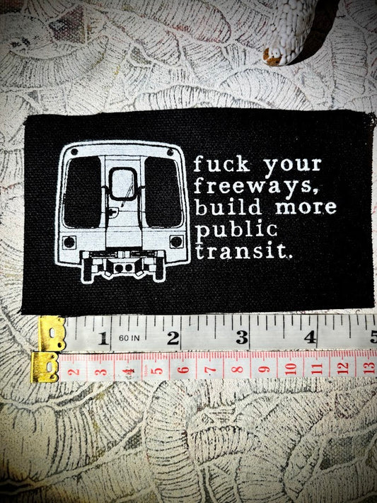 Fuck your freeways, build more public transit sew on patch.