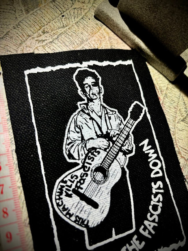 Woody Guthrie patch.