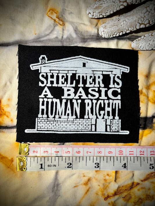 Shelter is a basic human right. sew on patch.