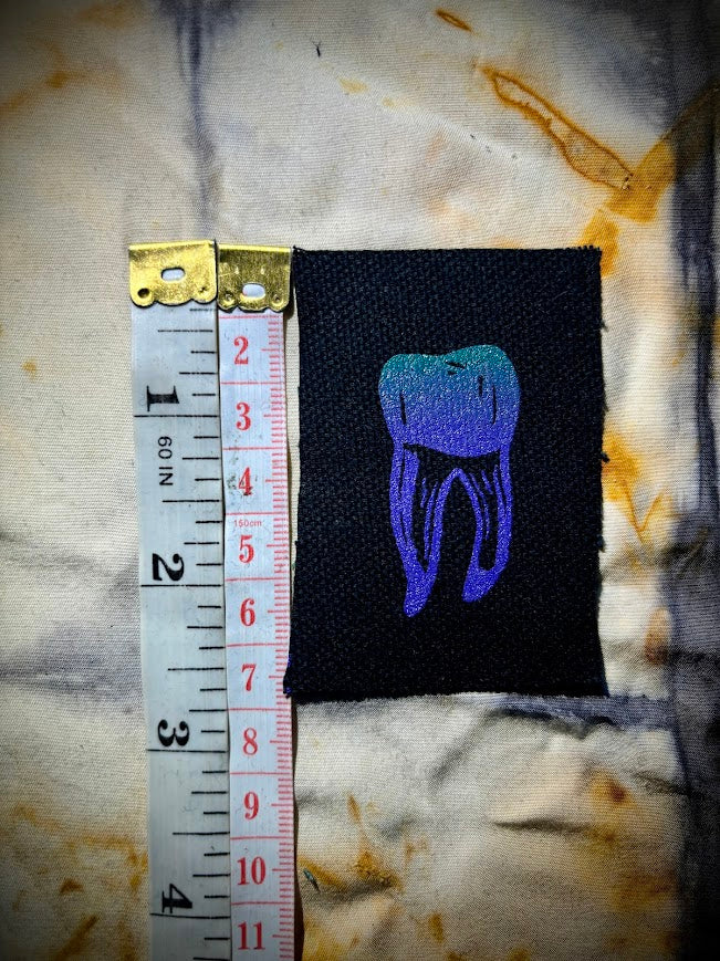 loose tooth patch. a mini patch with one toof.