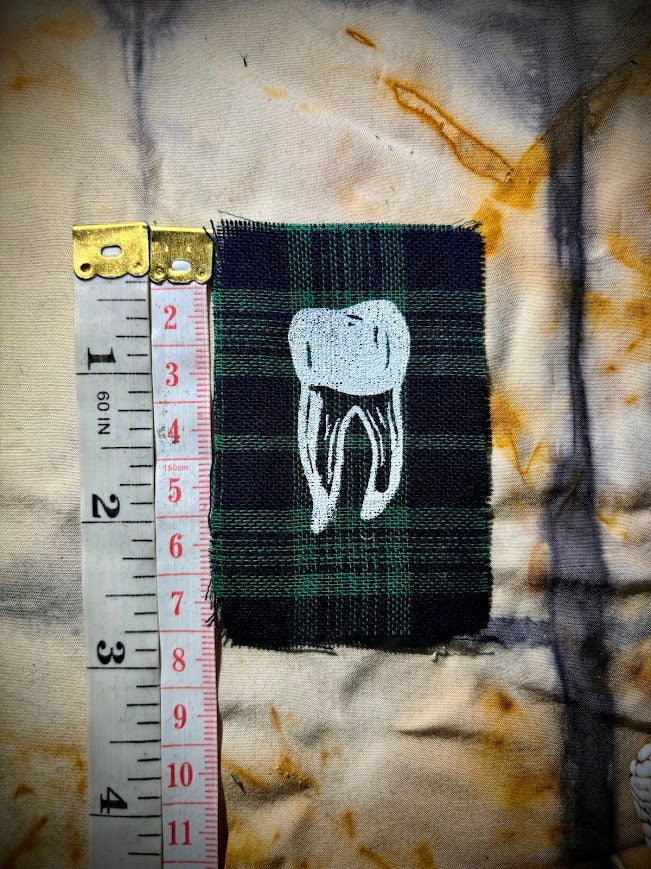 loose tooth patch. a mini patch with one toof.