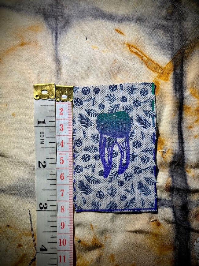 loose tooth patch. a mini patch with one toof.