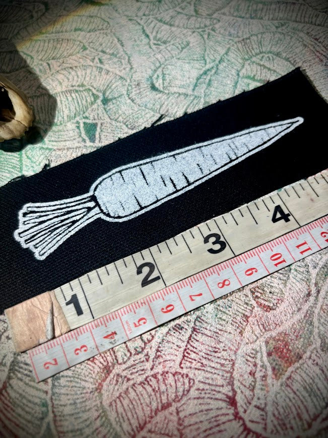 A Carrot, on a patch. that is all