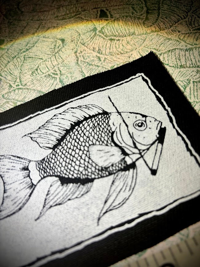 Fish smoking a cigarette patch