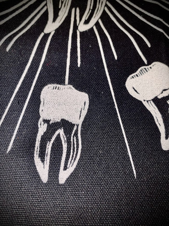 tooth angel, toof angel back patch. a buncha teeth in a big circle worshipping another tooth