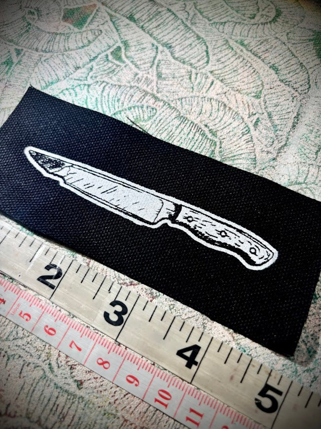 tiny knife patch.