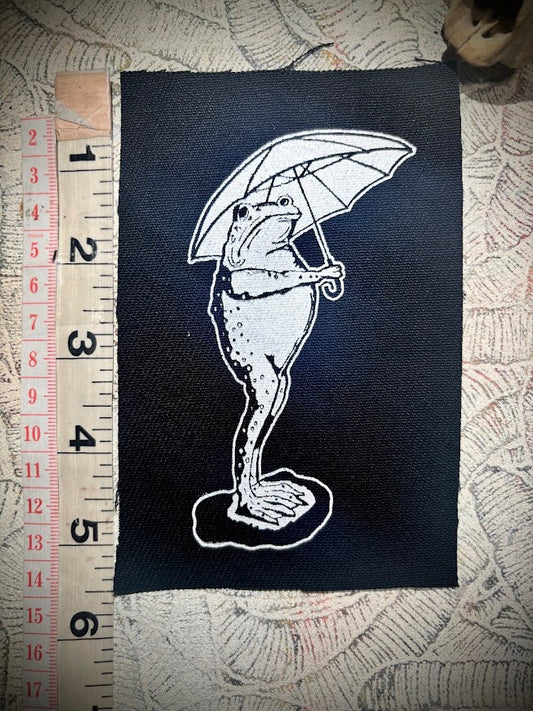 Sad frog holding an umbrella in the rain sew on patch