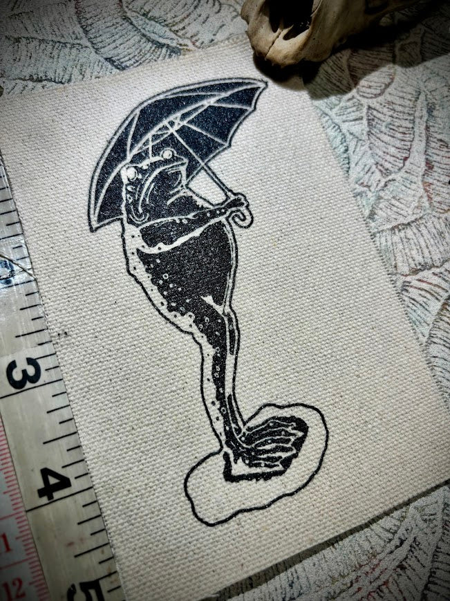 Sad frog holding an umbrella in the rain sew on patch