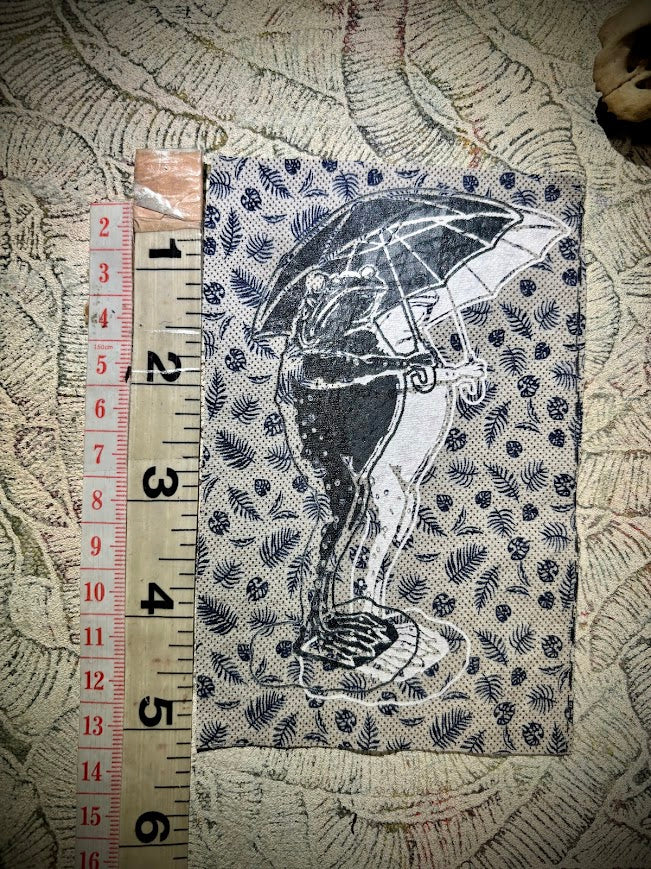 Sad frog holding an umbrella in the rain sew on patch