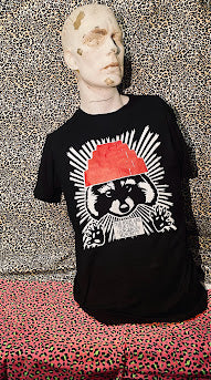 The rich are the only dangerous minority, with a raccoon wearing a devo hat