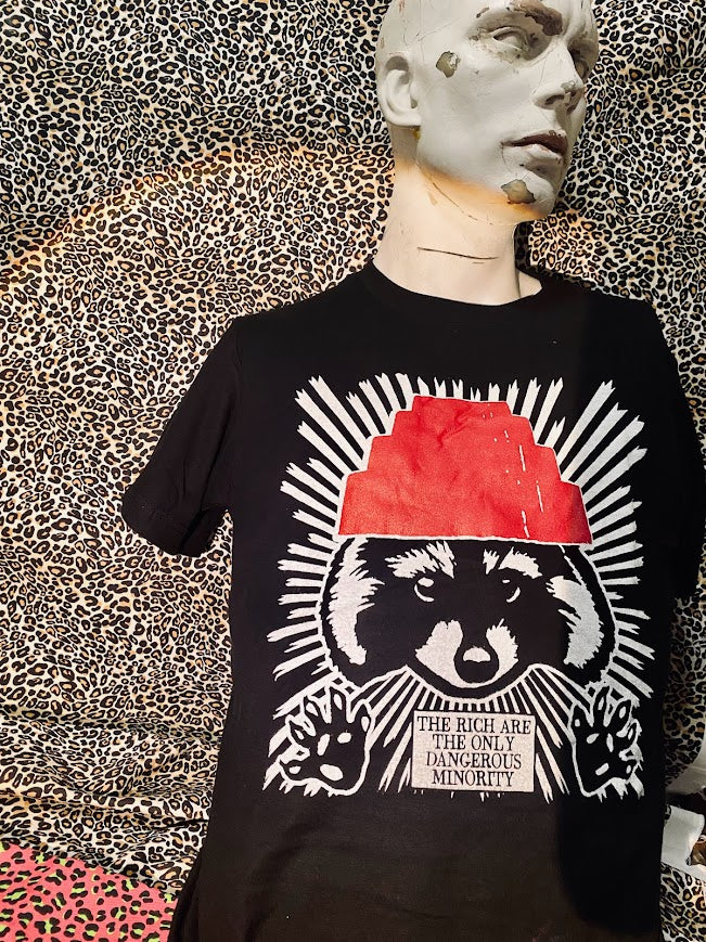 The rich are the only dangerous minority, with a raccoon wearing a devo hat