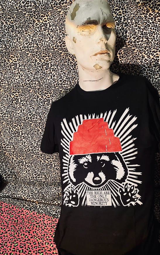 The rich are the only dangerous minority, with a raccoon wearing a devo hat