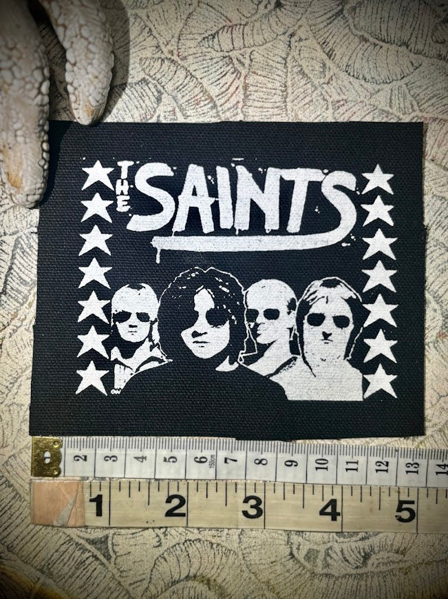 The Saints sew on patch.