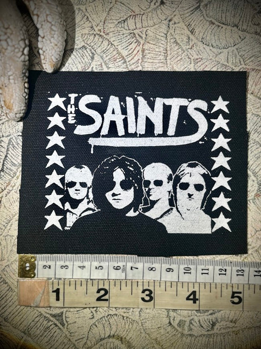 The Saints sew on patch.