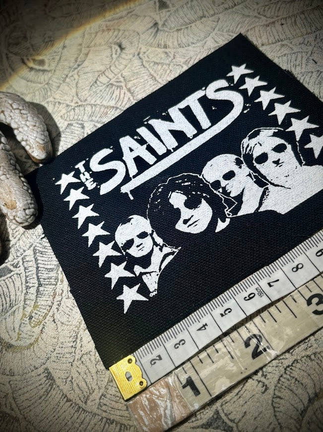 The Saints sew on patch.