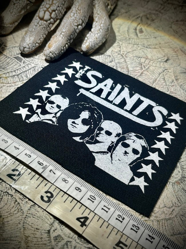 The Saints sew on patch.