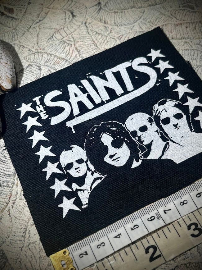 The Saints sew on patch.