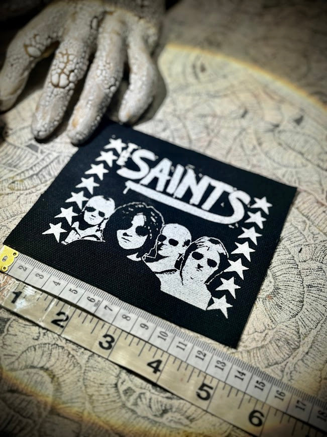 The Saints sew on patch.