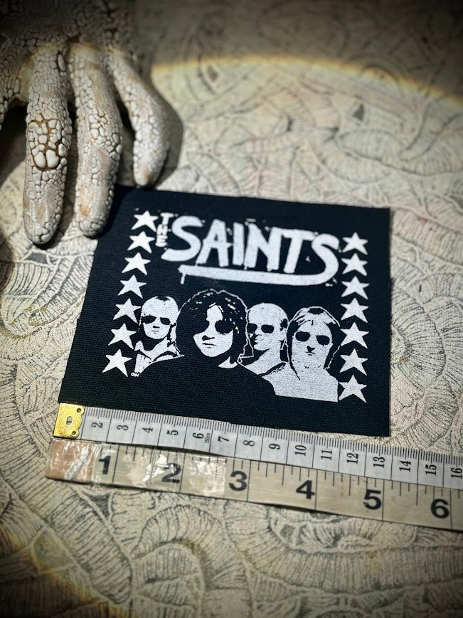 The Saints sew on patch.