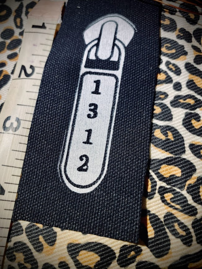 1312 ACAB zipper pull